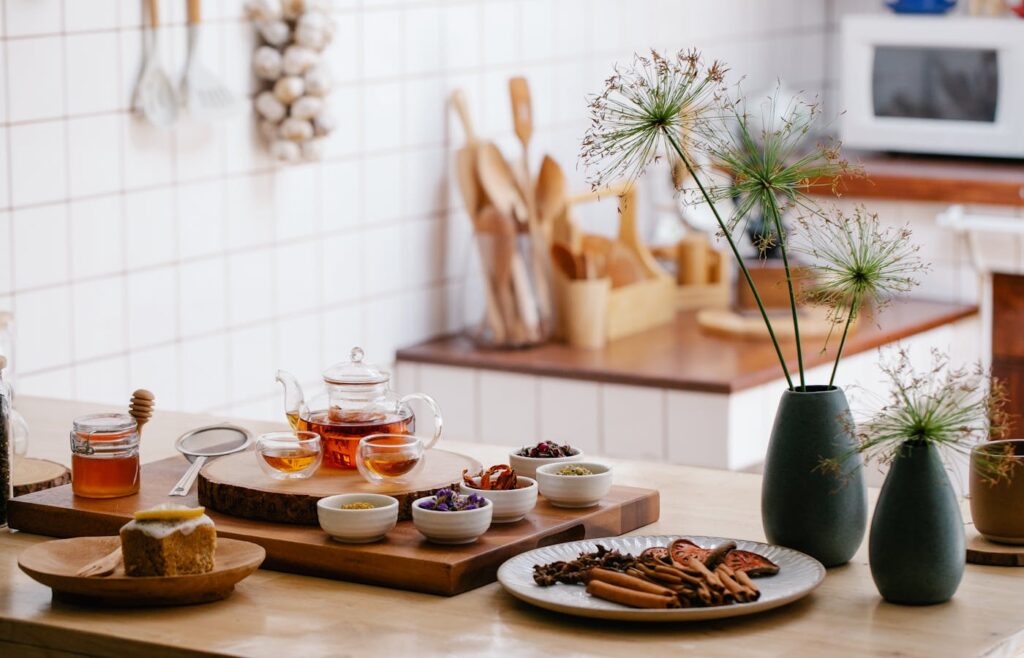 Kitchen counter with tea bowls of herbs and wooden utensils